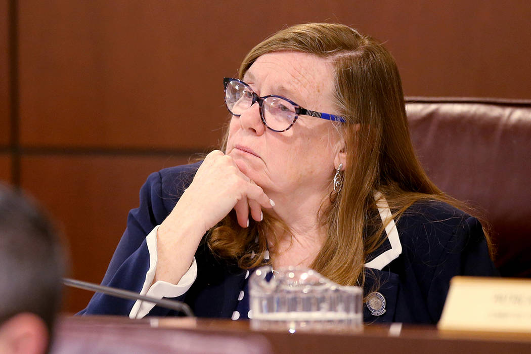 Assemblywoman Maggie Carlton, D-Las Vegas, listens to testimony during a Commerce and Labor Com ...