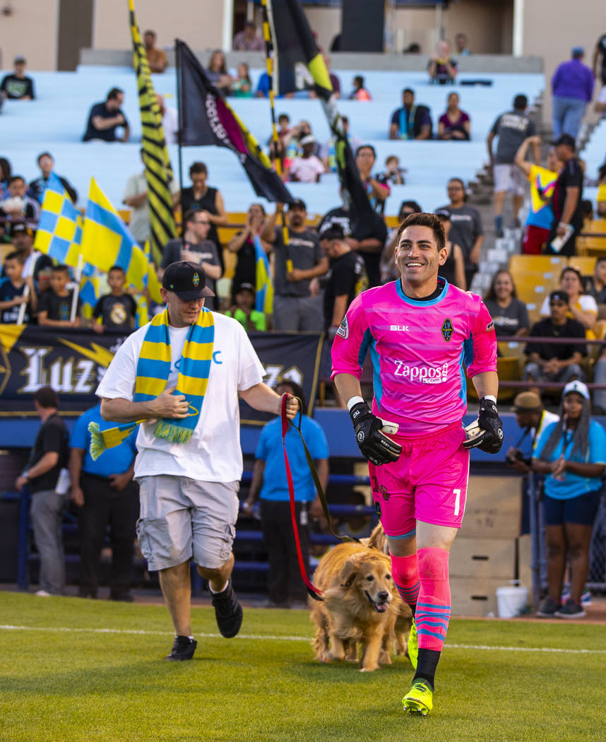 Las Vegas Lights FC goalkeeper Thomas Olsen (1) runs onto the field during player introductions ...