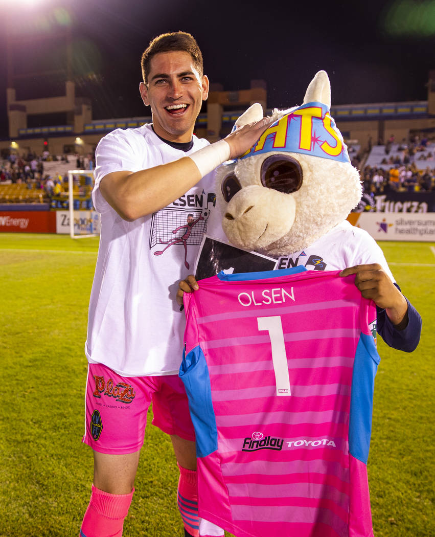 Las Vegas Lights FC goalkeeper Thomas Olsen (1) wears a custom t-shirt from Electric Company me ...