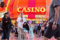 Fremont Street is packed with visitors on Thursday, March 28, 2019, in Las Vegas. (Benjamin Hag ...