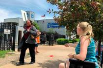 Teresa Pettis, right, greets a passerby May 17, 2019, outside the Planned Parenthood clinic in ...