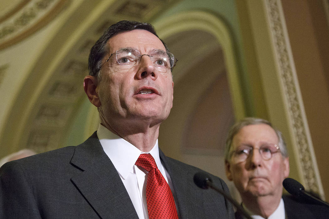 In this Feb. 14, 2012, file photo, Sen. John Barrasso, R-Wyo., left, accompanied by Senate Mino ...
