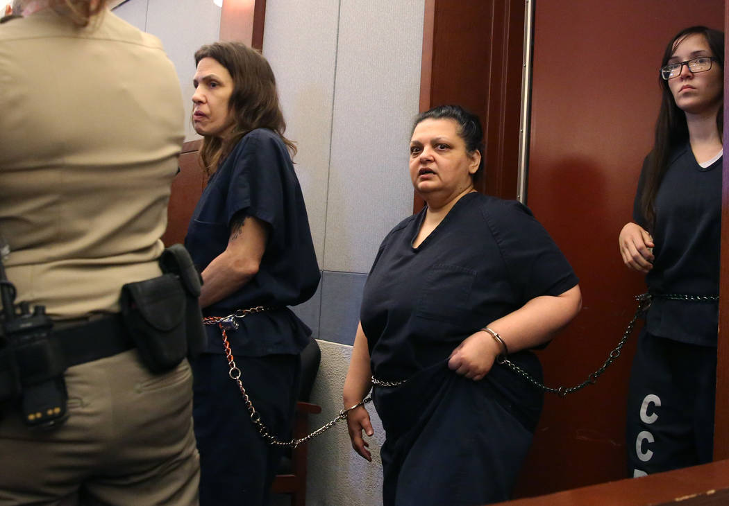 Sherry Marks, center, led into the courtroom during her preliminary hearing at the Regional Jus ...