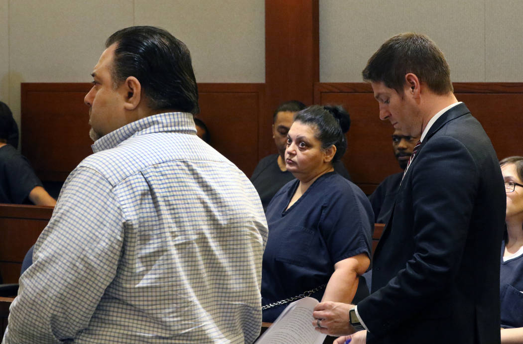 Sherry Marks, center, and her brother David Marks, left, accused of swindling a lawyer out of $ ...