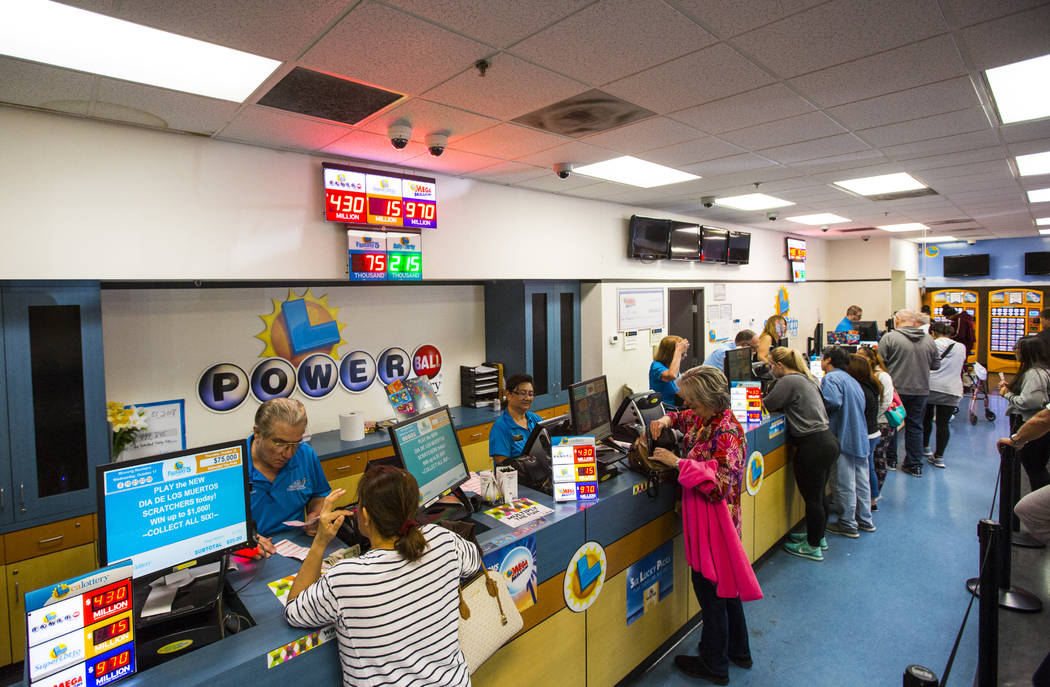 People line up inside of the Primm Valley Lotto Store for Mega Millions lottery tickets in Prim ...