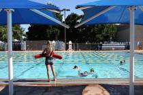Pool lifeguard Sophia Morris watches as children swim at Boulder City pool on Wednesday, May 29 ...