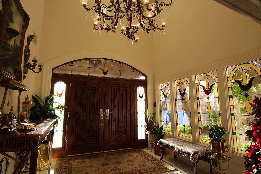 Mt. Charleston Realty The entry way features stained-glass windows and a large chandelier.