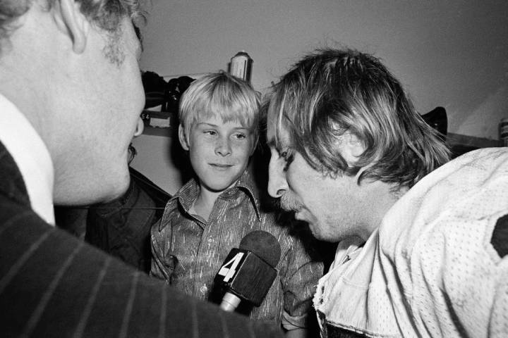 Ten-year-old Fred Biletnikoff Jr., center, looks in admiration at his father, one of the stars ...