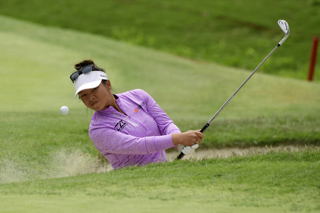 Danielle Kang hits out of a bunker on the fourth hole during the final round of the Hugel-Air P ...