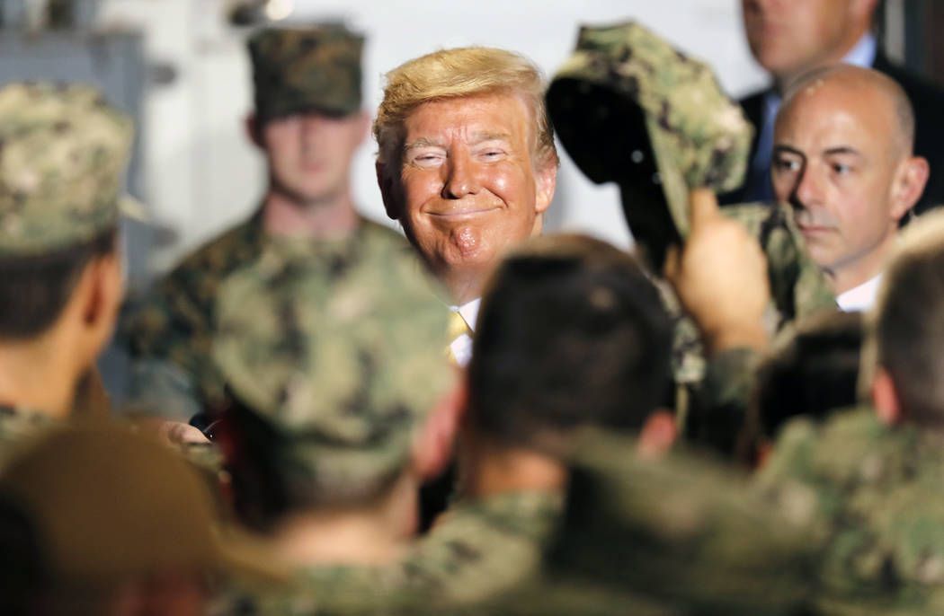 U.S. President Donald Trump greets to U.S. servicemen at U.S. Navy multipurpose amphibious assa ...