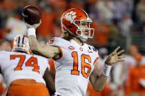 Clemson's Trevor Lawrence throws during the first half the NCAA college football playoff champi ...