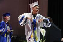 College of Southern Nevada High School student Carl Tiglao reacts as he prepares to receive his ...