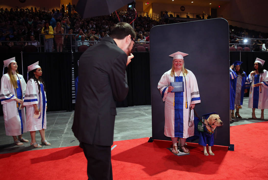 College of Southern Nevada High School student Sydney Hansen and her yellow lab, Boswell, pose ...