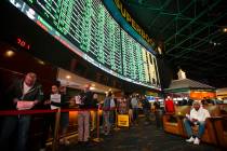 Bettors line up to place prop bets for the Super Bowl at the Westgate Superbook in Las Vegas on ...