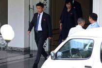 Kim Hyok Chol, left, North Korea's special representative for U.S. affairs, leaves the Governme ...