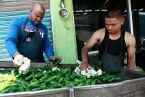 Workers prepare peppers for export from Mexico to the United States, in Ciudad Juarez, Mexico, ...