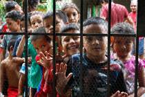 Migrant children line up for a meal at the door of the Jesus del Buen Pastor del Pobre y el Mig ...