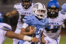 Centennial sophomore quarterback Colton Tenney (10) runs for big yardage against Sierra Vista i ...