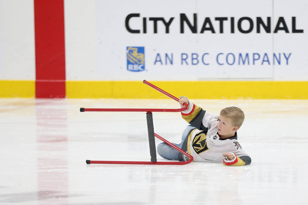 Weston Gregory, 6, takes a fall during the Jake Kielb's Hockey Foundation open skate session at ...