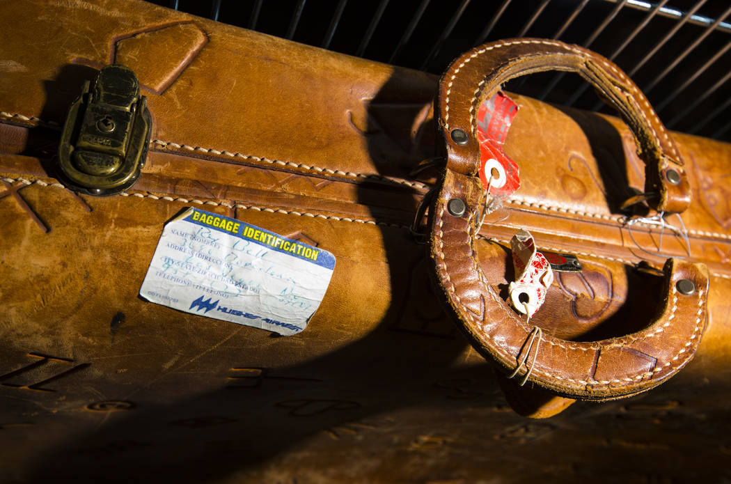 A leather suitcase with a handwritten ID tag from Rex Bell is seen as items from Walking Box Ra ...