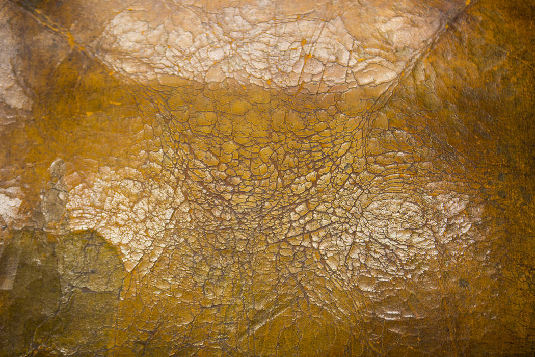 Cracked leather on a chair from Walking Box Ranch, in Searchlight, at UNLV's Paradise campus in ...