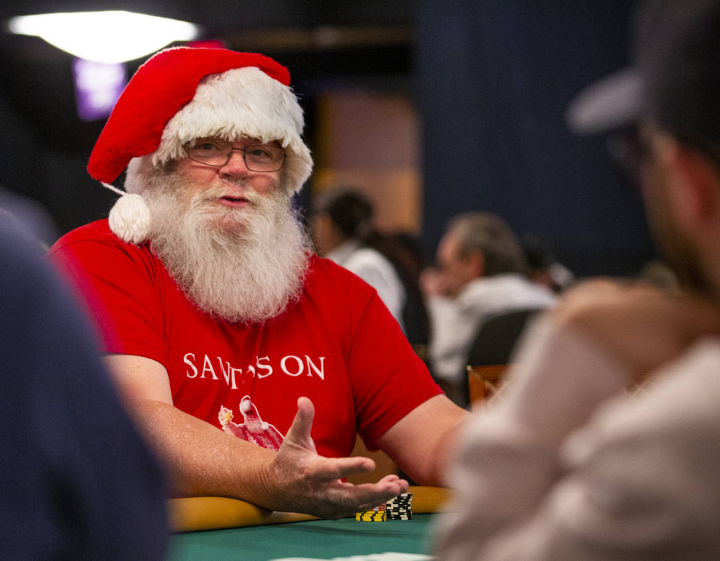 Jeff "Nicholas" Camp, of Richmond, Va., is dressed as Santa and is pleased to be at t ...
