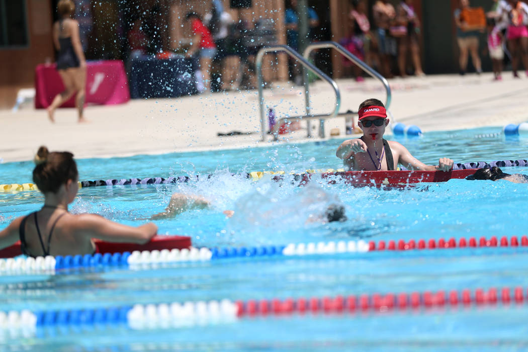 Lifeguards Abbie Hendricks, left, and Tommy Harkin, monitor the pool during the annual Ward 4 S ...