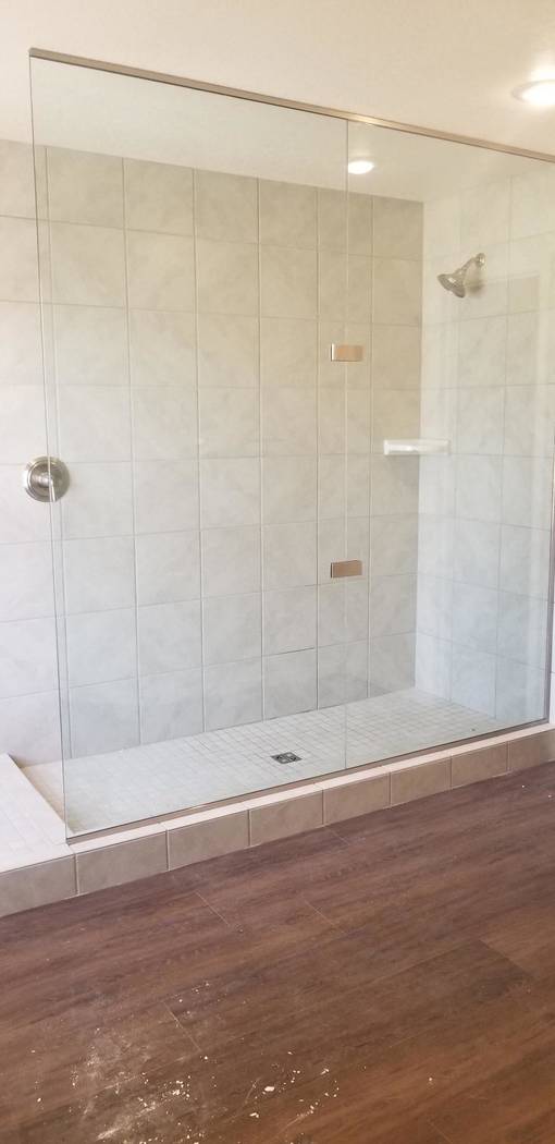 This May, 2019, photo provided by HomeAid of Southern Nevada shows the new master bathroom in L ...