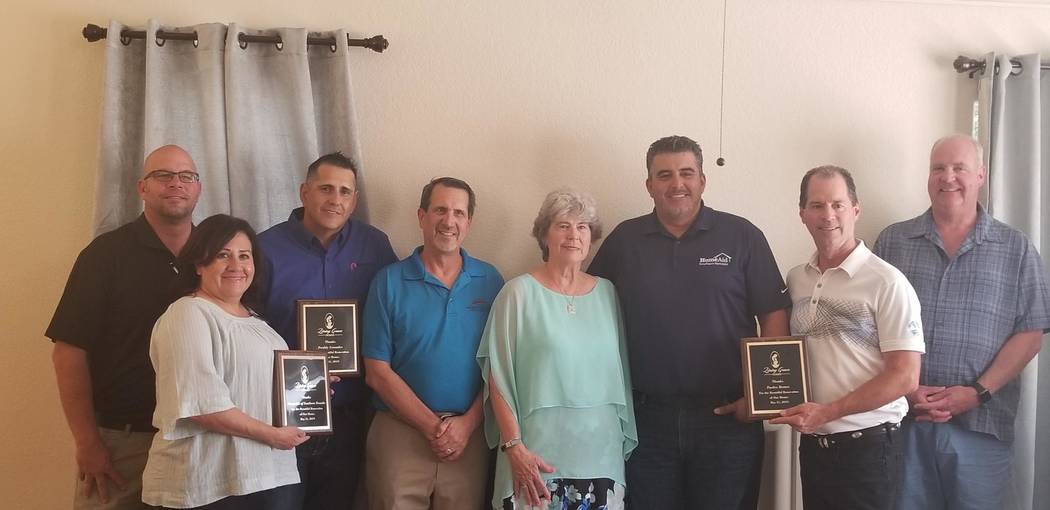 This May 31, 2019, photo provided by HomeAid of Southern Nevada shows representatives from Home ...