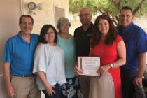 This May 31, 2019, photo provided by HomeAid of Southern Nevada shows representatives from Home ...