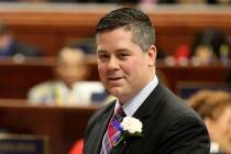 Assemblyman Steve Yeager, D-Las Vegas, signs the oath of office forms on the Assembly floor in ...