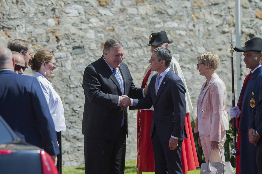 U.S. Secretary of State Mike Pompeo, left, and Swiss Foreign Minister Ignazio Cassis, right, sh ...