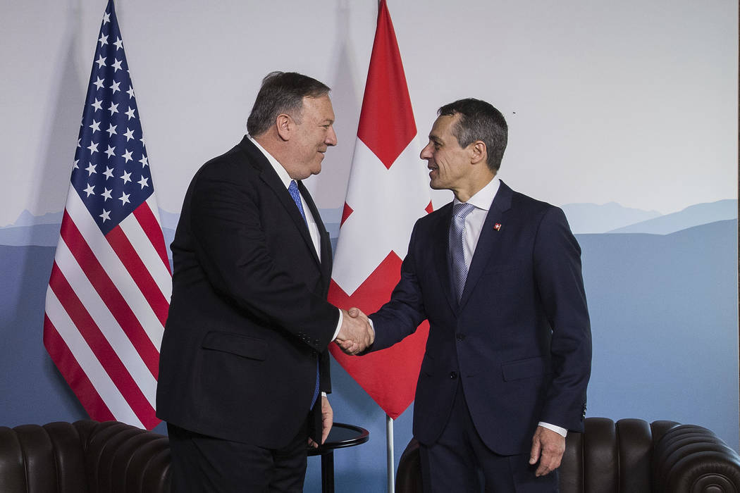 U.S. Secretary of State Mike Pompeo, left, and Swiss Foreign Minister Ignazio Cassis, right, sh ...