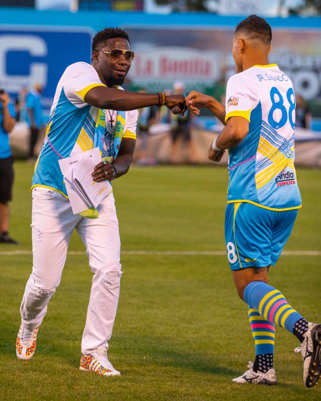 Las Vegas Lights FC midfielder Junior Sandoval (88) and hype man Robert "Bojo" Ackah fist bump ...