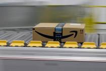 A box for an Amazon prime customer moves through the new Amazon Fulfillment Center in Sacrament ...