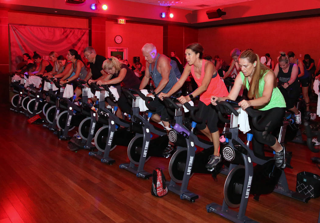 Members at Lifetime Athletic exercise during spinning class on Monday, June, 3 2019, in Henders ...