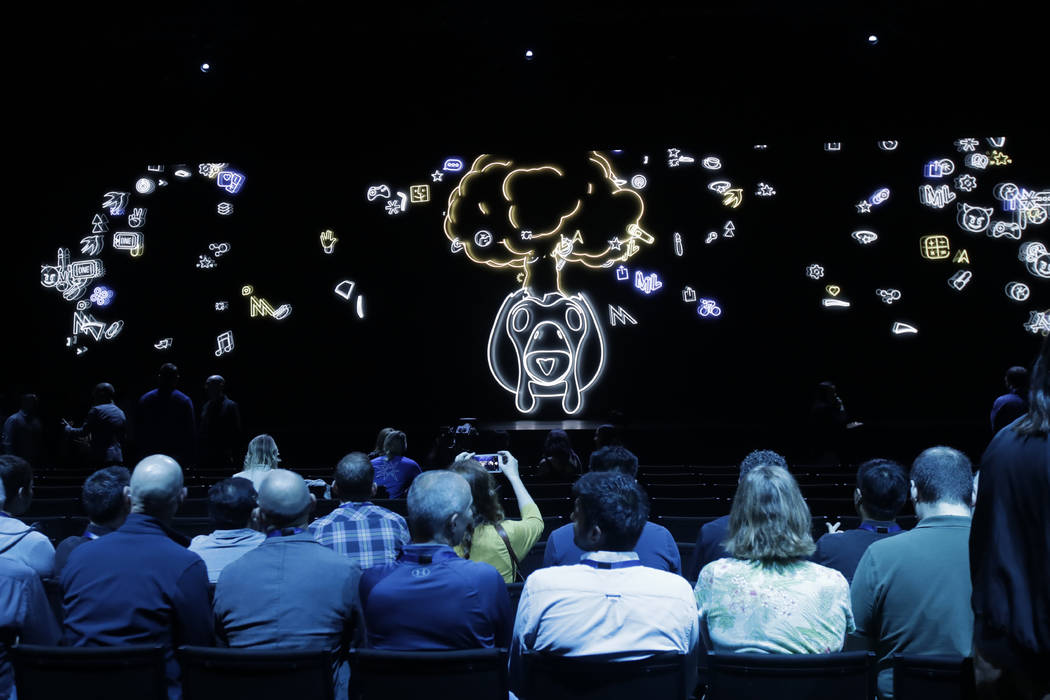 Attendees await the start of the keynote address at the Apple Worldwide Developers Conference i ...