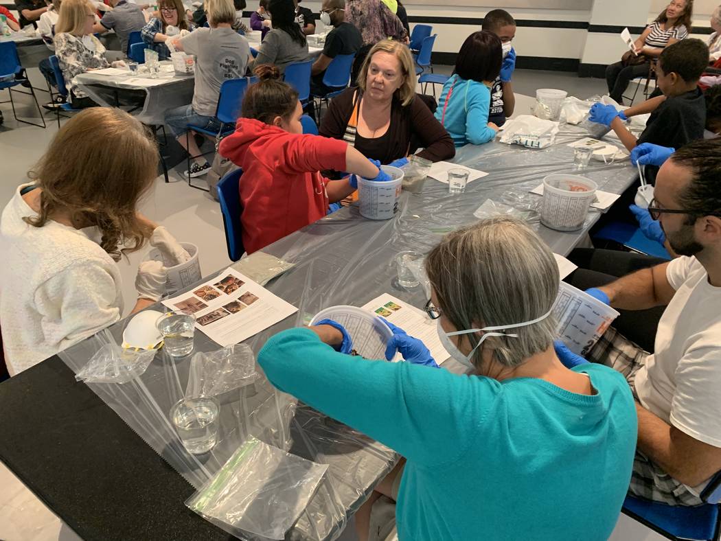 A crowd of people filled the multipurpose room at the Sahara West Library on May 23 to make hyp ...