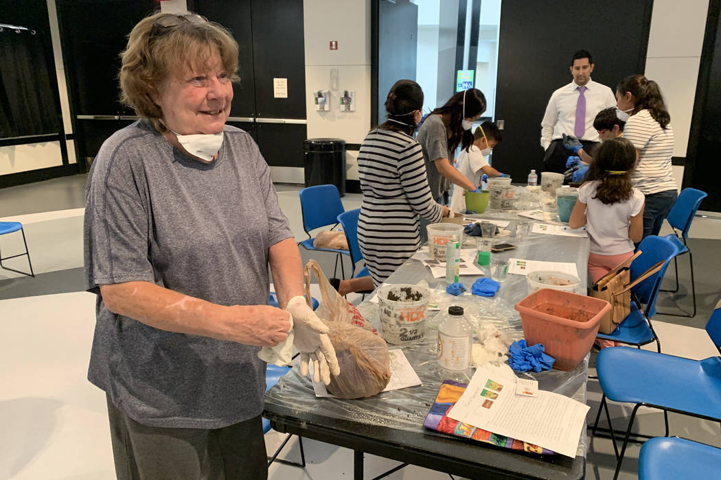 Susan Greene, 69, an attendee at the hypertufa pot making event, prepares to cleanup after crea ...