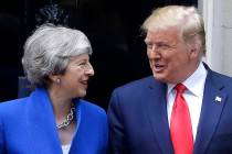 Britain's Prime Minister Theresa May greets President Donald Trump outside 10 Downing Street in ...
