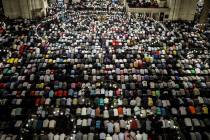 Turkey's Muslims offer prayers during the first day of Eid al-Fitr, which marks the end of the ...