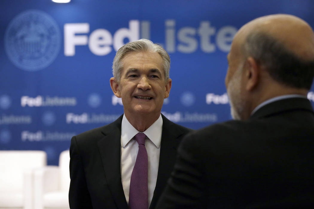 Federal Reserve Chairman Jerome Powell, left, talks to former Federal Reserve Chairs Ben Bernan ...