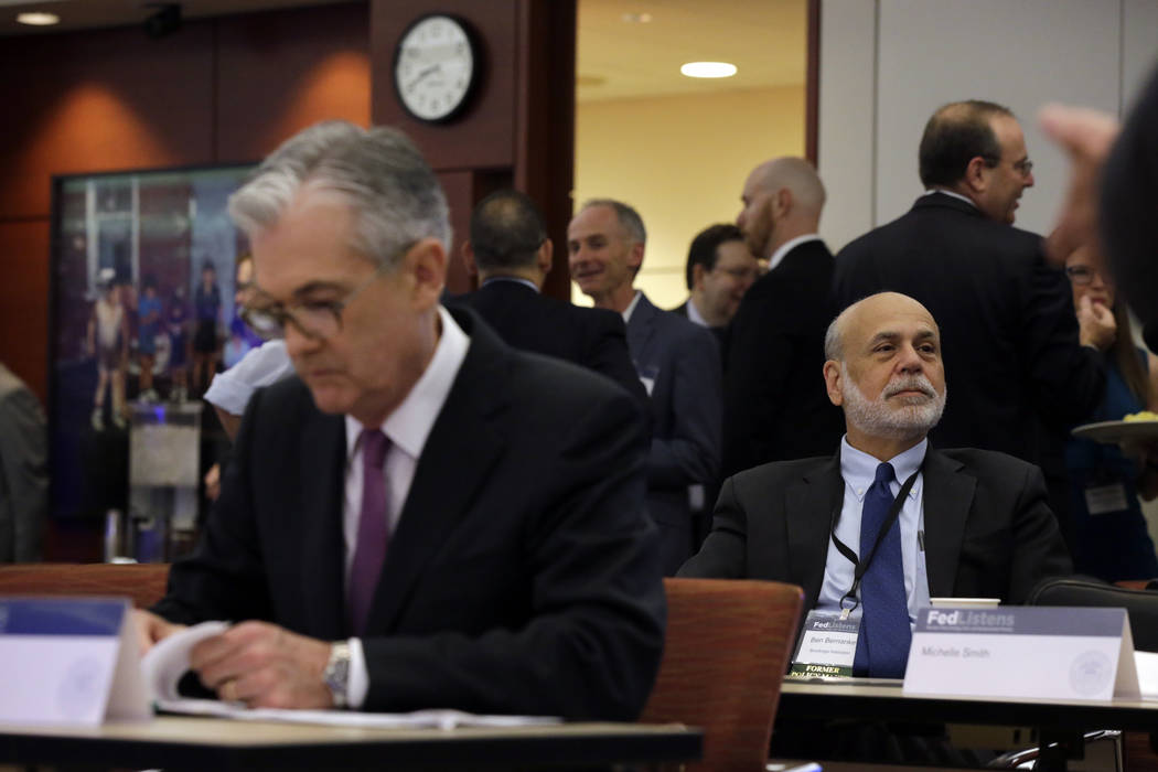 Former Federal Reserve Chairs Ben Bernanke, right, sits as federal Reserve Chairman Jerome Powe ...
