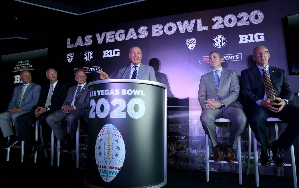 Pete Derzis of ESPN Events, from left, Steve Hill, CEO and president of the Las Vegas Conventio ...