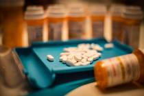 Unsorted prescription pills sit in a pharmacist's counting tray before they are bottled. (Getty ...