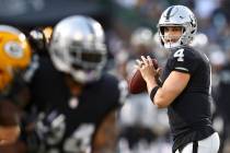 Oakland Raiders quarterback Derek Carr (4) looks for a receiver during the first half of the te ...