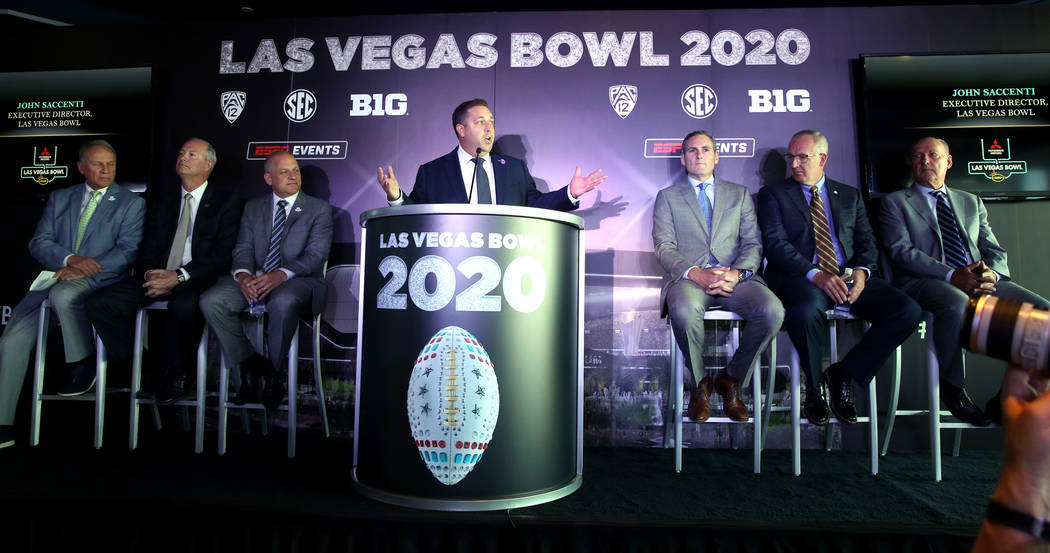 Pete Derzis of ESPN Events, from left, Steve Hill, CEO and president of the Las Vegas Conventio ...