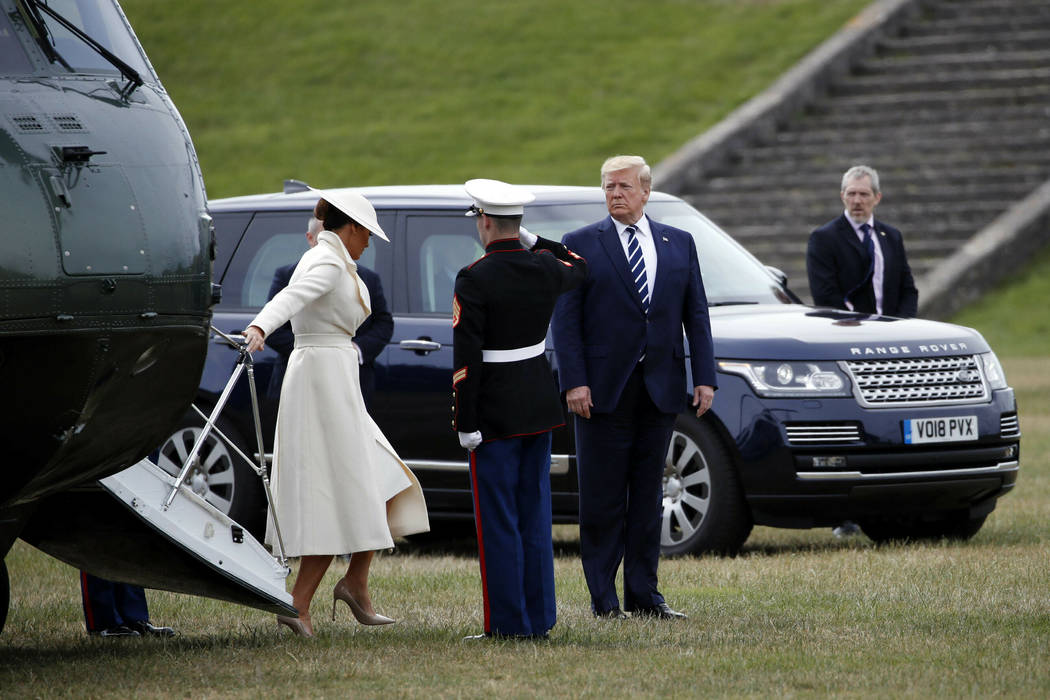 President Donald Trump and first lady President Donald Trump arrive to participate in a D-Day c ...