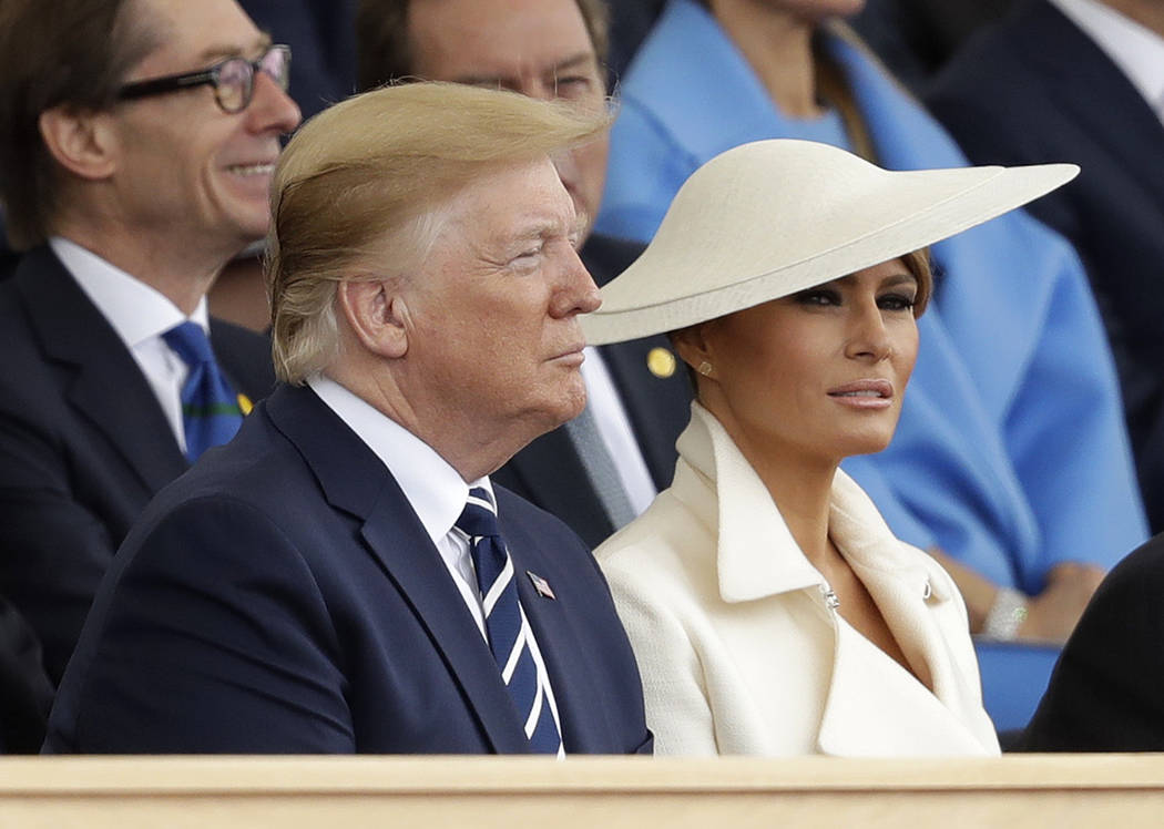 President Donald Trump and first lady Melania Trump attend an event to mark the 75th anniversar ...