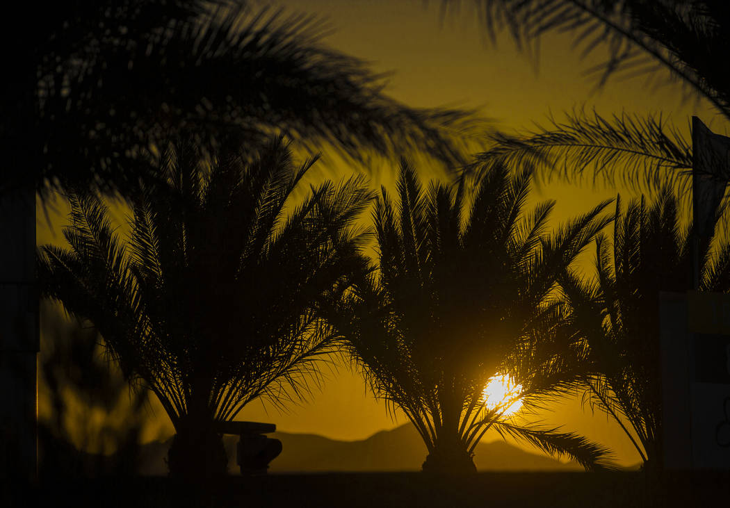 The sun rises in the northwest Las Vegas Valley on Wednesday, June, 5, 2019, in Las Vegas. The ...